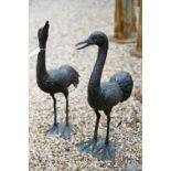 A companion pair of weathered bronze patinated garden birds