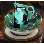 A Jane Cox studio pottery ewer and basin painted with stylised foliate design, signed on bases, bowl