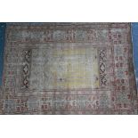 An antique Anatolian prayer rug, worn, 158 x 115 cm