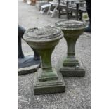 A pair of weathered cast stone planters a/f