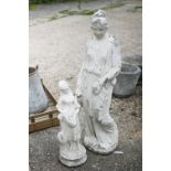 A large cast stone garden figure to/w another smaller - both later painted and distressed (2)
