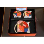 A boxed Wedgwood Clarice Cliff commemorative 'Stamford Bizarre' three piece tea set, painted with