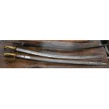 A 19th century Indian sabre with curved and fullered 77 cm blade and cast tulwar hilt to/w two later