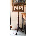 A mahogany and brass adjustable lyre design single music stand on turned column and triform supports