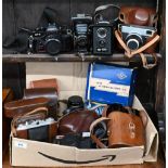 Various vintage and later cameras, including Ricoh KR-5 35 mm SLR, Agfa Isolette, Zeiss Werra,
