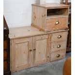 A stripped pine side cabinet with panelled doors and three drawers with brass handles, 122 x 30 x 60