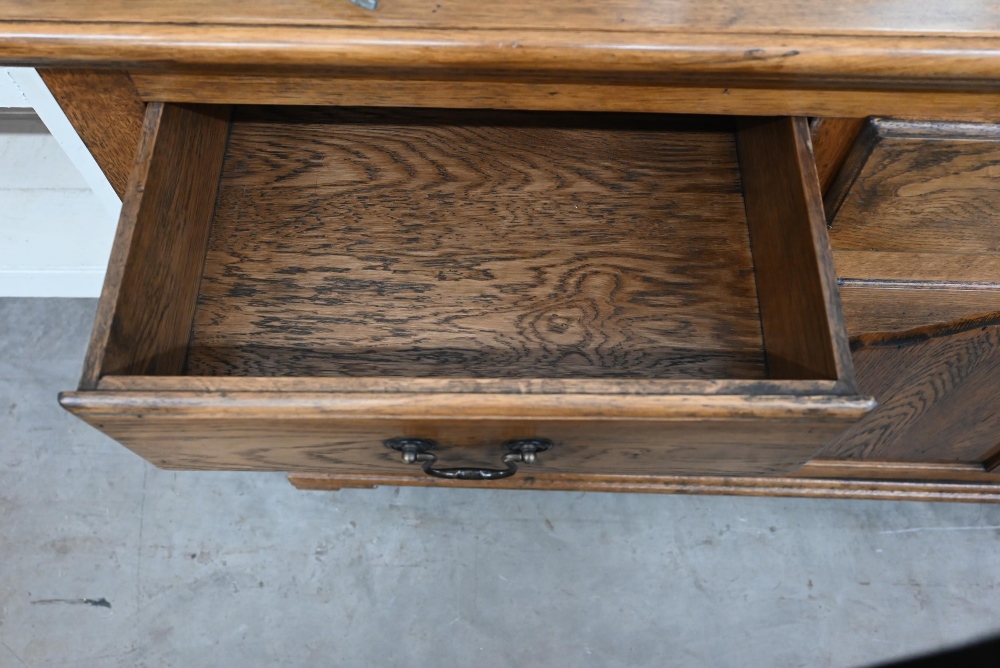 A good quality modern oak sideboard with three drawers over panelled cupboards standing on bracket - Image 2 of 3