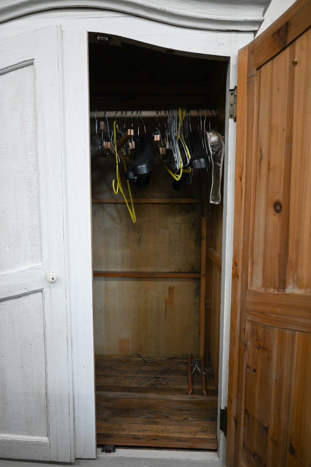 A cream painted pine armoire wardrobe with panelled doors and single drawer (in two sections), by - Image 3 of 3