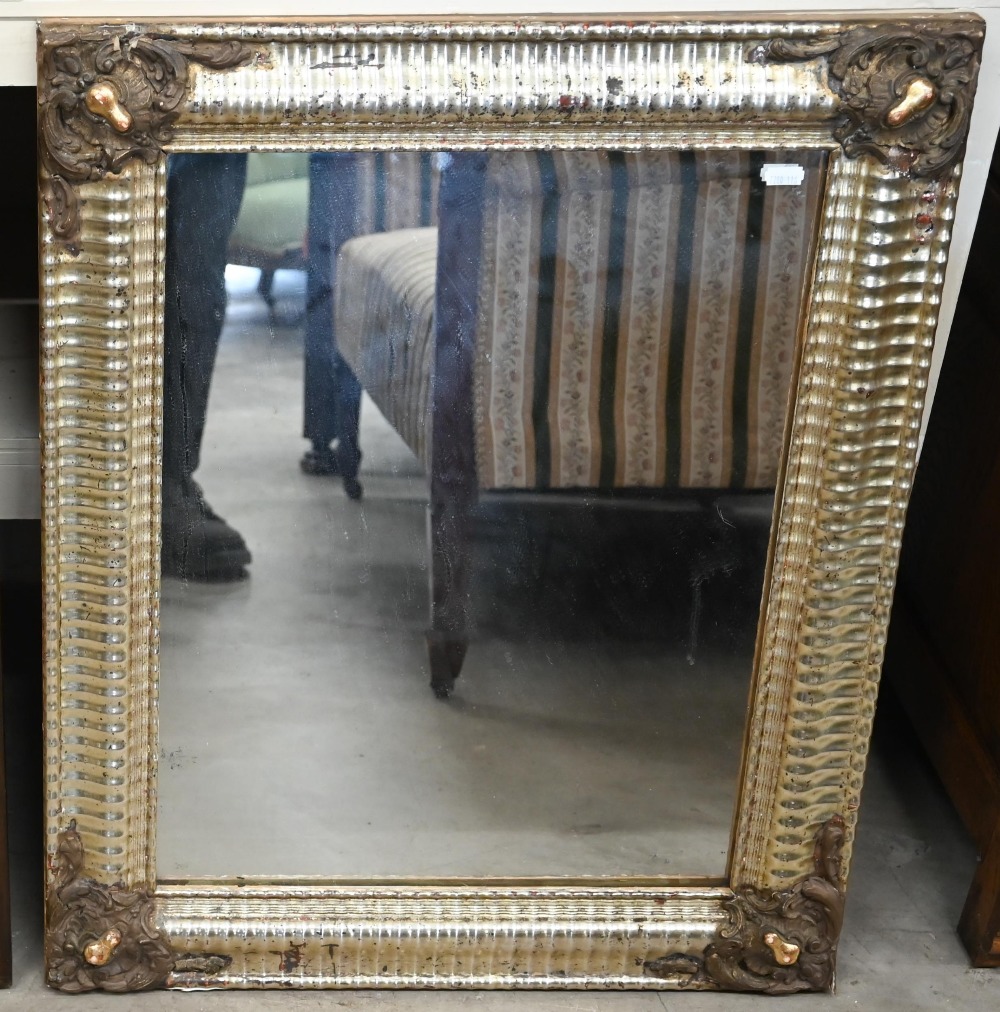 A French rectangular wall mirror in decorative gilt and silvered ripple moulded frame, 58 cm wide