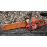 A used Husqvarna 136 chainsaw, as seen