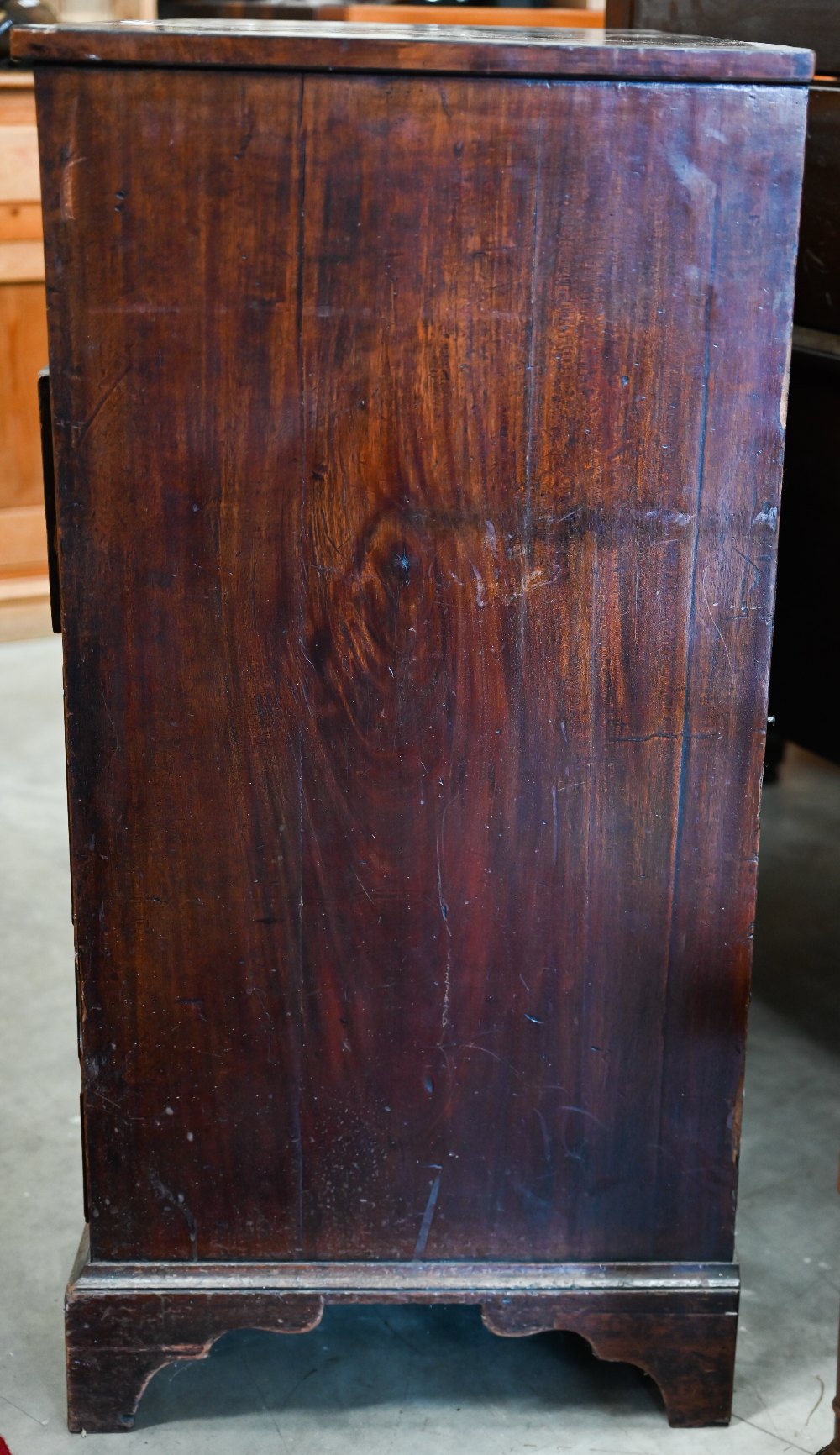 A George III mahogany chest of two short over three long drawers with brass oval handles cast with - Image 7 of 9