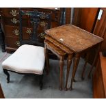 A nest of three reproduction walnut veneered tables and a low carved chair (4)