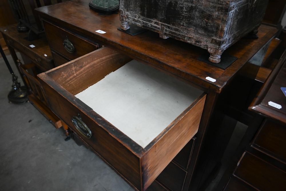 A George III mahogany chest of two short over three long drawers with brass oval handles cast with - Image 3 of 9