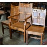 A panelled oak church armchair to/w pair of matching side chairs, with inscription 'IHS' (3)