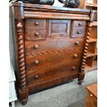 A large Victorian mahogany chest with cavetto drawer over an arrangement of seven other drawers