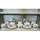 A Royal Worcester set of twelve coffee cans and saucers, monochrome-printed with birds