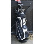 A Taylormade golf bag with mixed part sets of Callaway golf clubs