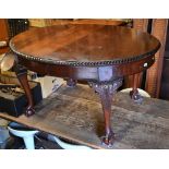 A mahogany wind action extending dining table with single leaf to/w a set of five matching