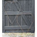 A pair of steel twin heart form plant frames (2)