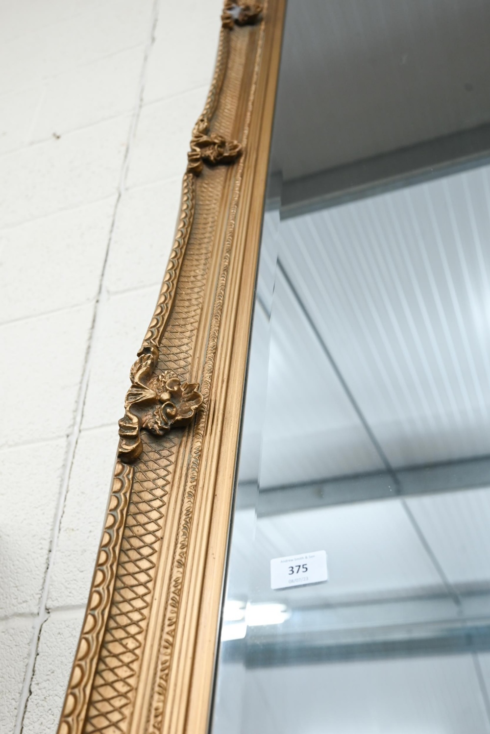 A large Baroque style gilt framed wall mirror with bevelled plate - Image 2 of 3