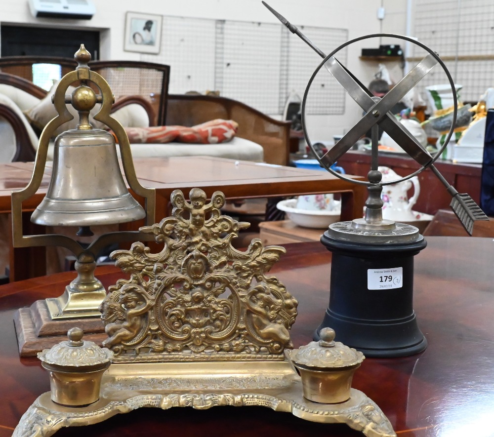 A modern brass Armillary sundial, 15 cm diameter, to/w a counter-bell on a bracket and a brass