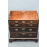 A George III mahogany bureau, the fitted interior with slide top well over a dummy drawer, two short