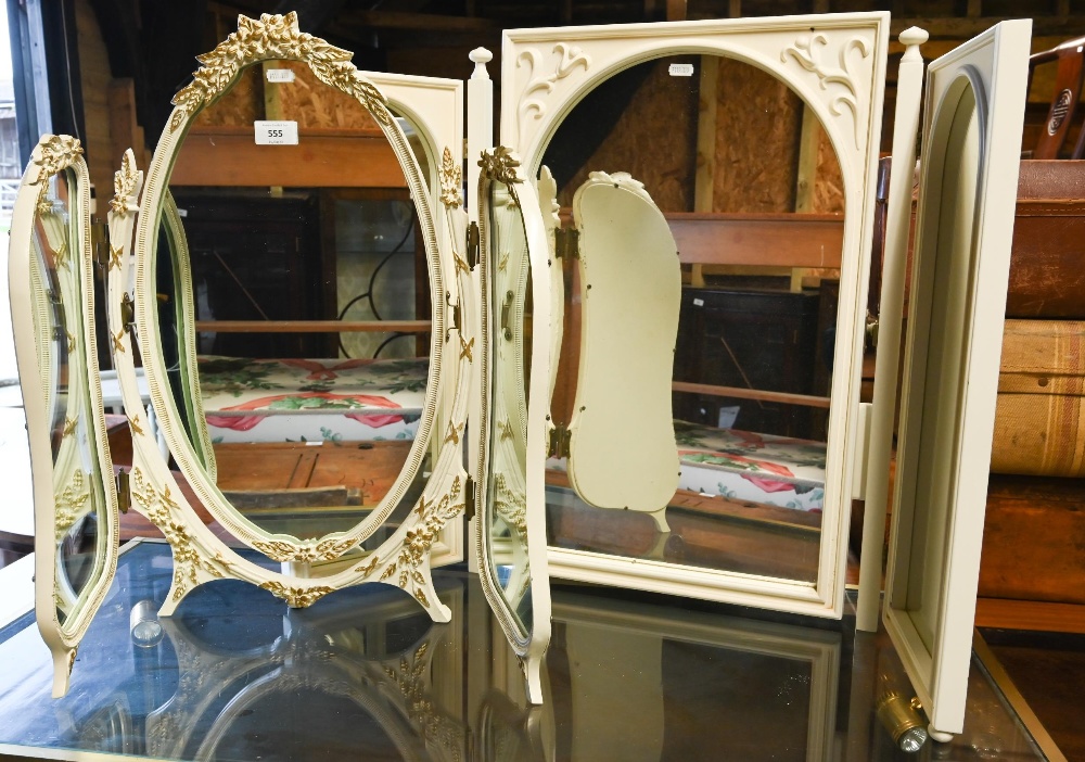 An off-white and gilt folding three panel table top dressing mirror, to/w a white triptych