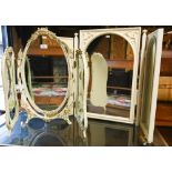 An off-white and gilt folding three panel table top dressing mirror, to/w a white triptych