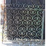 A pair of antique wrought iron and strapwork country house garden gates, previously at Crawley
