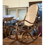 A Thonet style bentwood rocking chair with cane worked back and seat