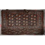 A vintage Turkoman brown and red geometric gul design bag-face, 125 cm x 73 cm