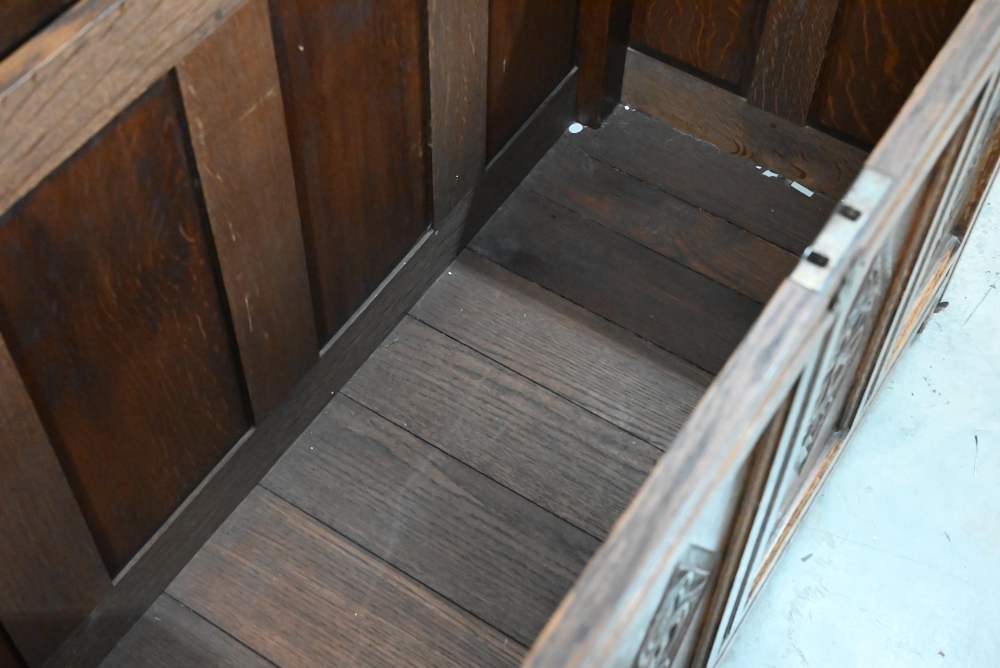 A traditional oak coffer with carved lozenge decoration, on stile feet, 133 x 55 x 76 cm high - Image 3 of 3