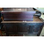 A carved oak panelled coffer 118 x 44 x 60 cmh to/w a trunk (2)