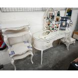 A cream paint finished Italian-style mirror-backed kidney shaped dressing table by Fairyland to/w
