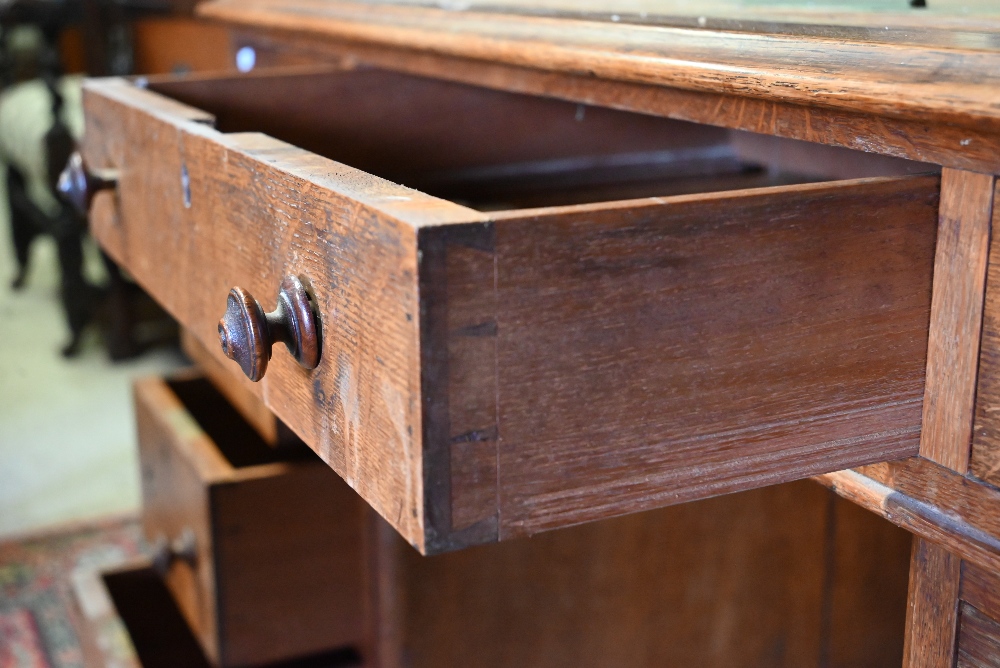A Victorian oak twin pedestal desk, with nine drawers, raised on plinths and concealed castors - - Image 4 of 4