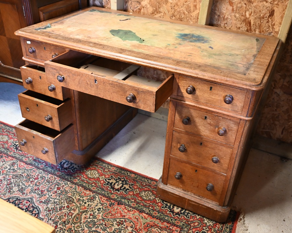 A Victorian oak twin pedestal desk, with nine drawers, raised on plinths and concealed castors - - Image 2 of 4