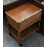 Oak sewing table c/w 'Simplicity' patterns, box of buttons, threads, etc