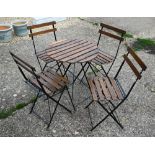 A weathered five piece wood slat and steel folding framed terrace set, the circular table 60 cm dia.