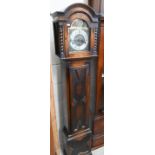 An oak shortcase clock with geometric panelled case, brass dial and triple train movement,
