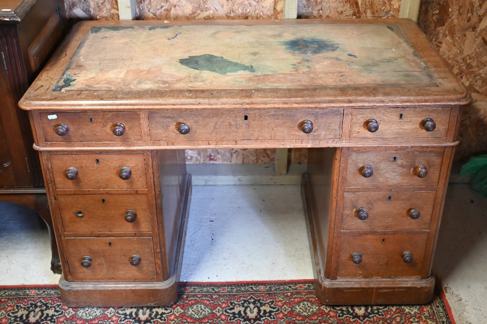 A Victorian oak twin pedestal desk, with nine drawers, raised on plinths and concealed castors - - Image 3 of 4