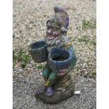 A part polychrome painted reconstituted garden gnome