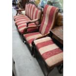 An Edwardian moulded walnut framed three seat salon sofa to/w a Victorian salon open armchair and