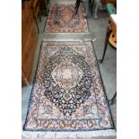 Two Indo-Persian traditional floral design blue ground rugs, 150 x 94 cm and 154 x 94 cm (2)