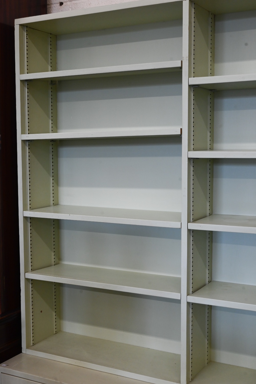 A green-painted bookcase with adjustable open shelving over panelled cupboards, 122 cm wide x 40 - Image 4 of 4