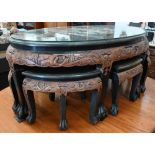 A Chinese part lacquered and carved hardwood oval table, the top with applied imitation mother-of-