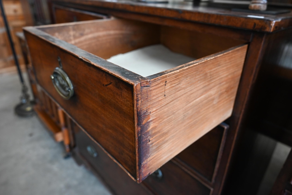 A George III mahogany chest of two short over three long drawers with brass oval handles cast with - Image 4 of 9