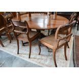 Six Regency mahogany rope back dining chairs with caned seats to/w an oval dining table with a