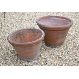 Enzo Zago, two weathered circular Tuscan terracotta planters, 57 cm dia. x 38 cm h and 50 cm dia.