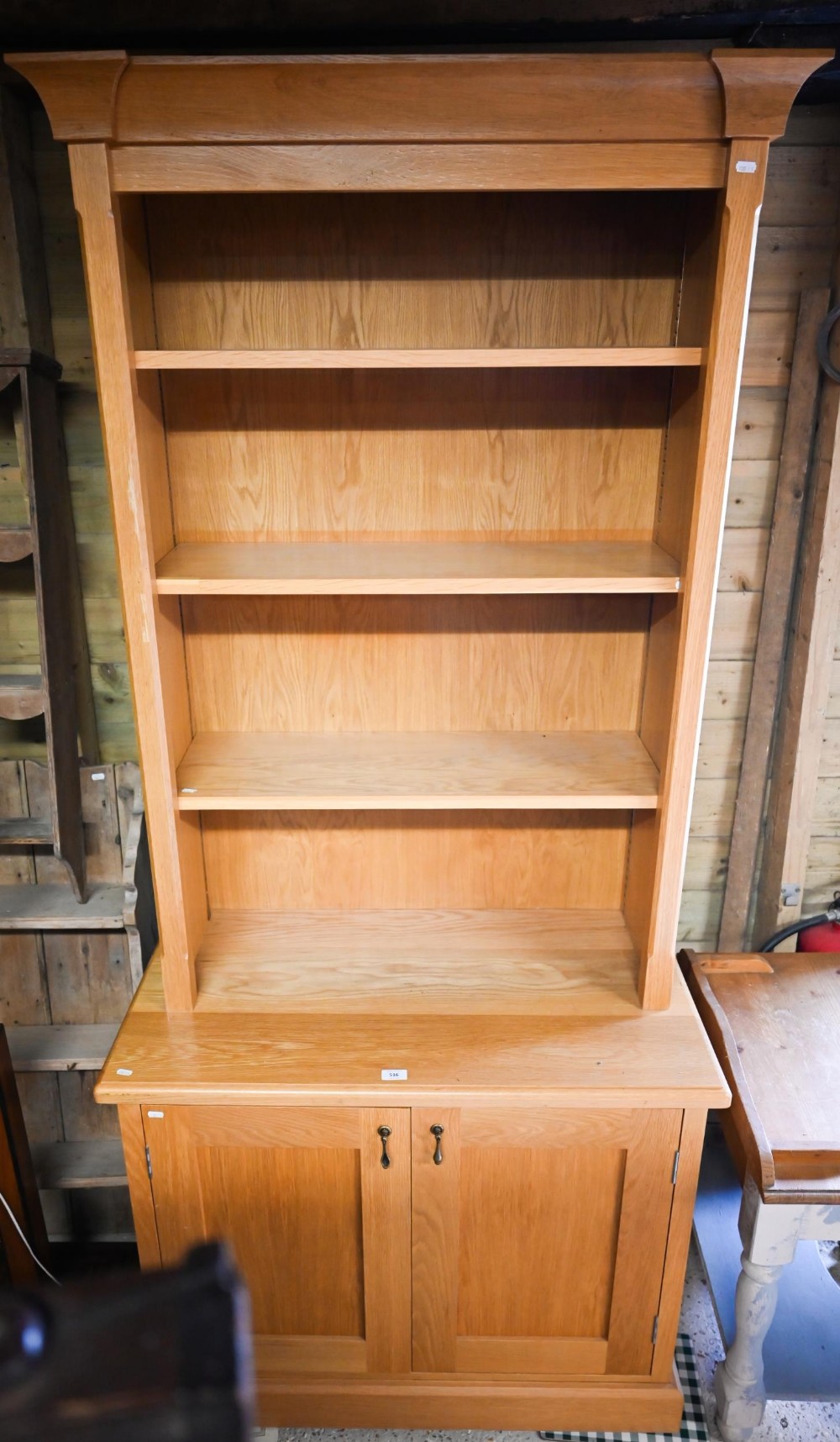 A modern oak cabinet bookcase with three adjustable shelves over base with panelled cupboard, 95 x - Image 2 of 3