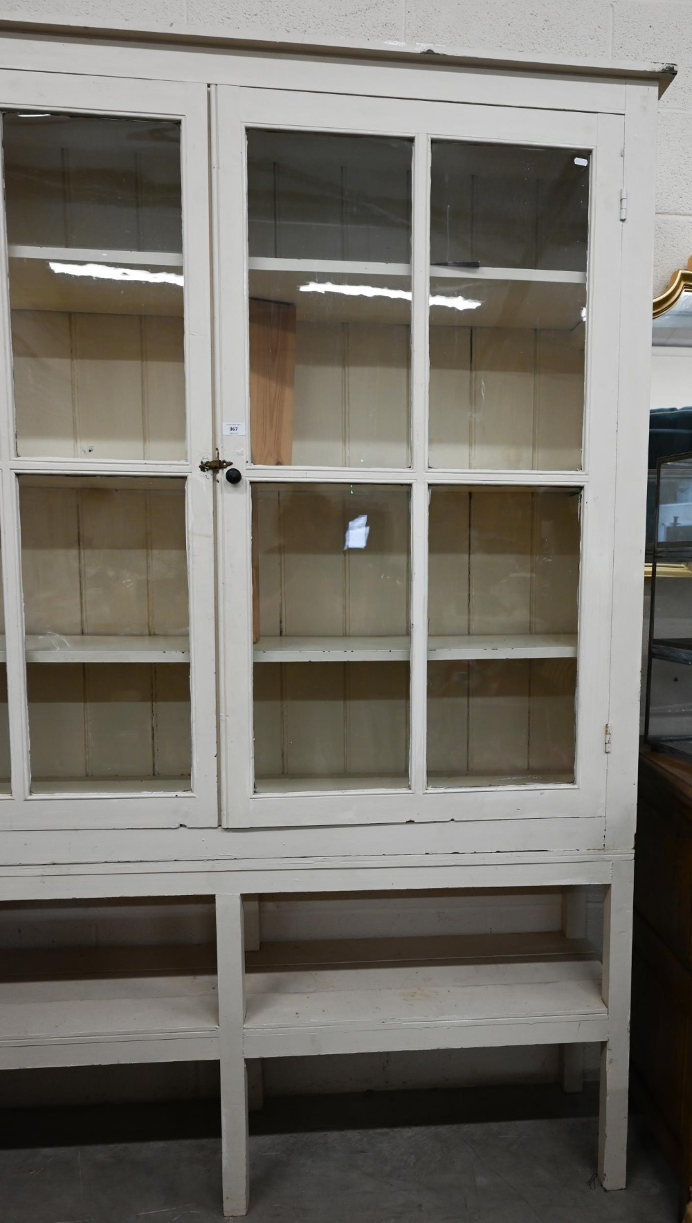 A large cream painted pine bookcase with glazed doors enclosing three shelves with open shelf below, - Image 2 of 4